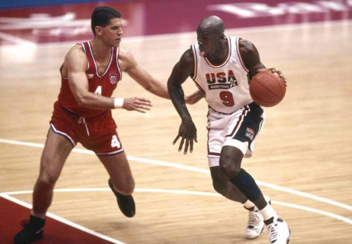 USA Dream Team guard Michael Jordan (9) is defended by Croatia guard Drazen Petrovic (4)